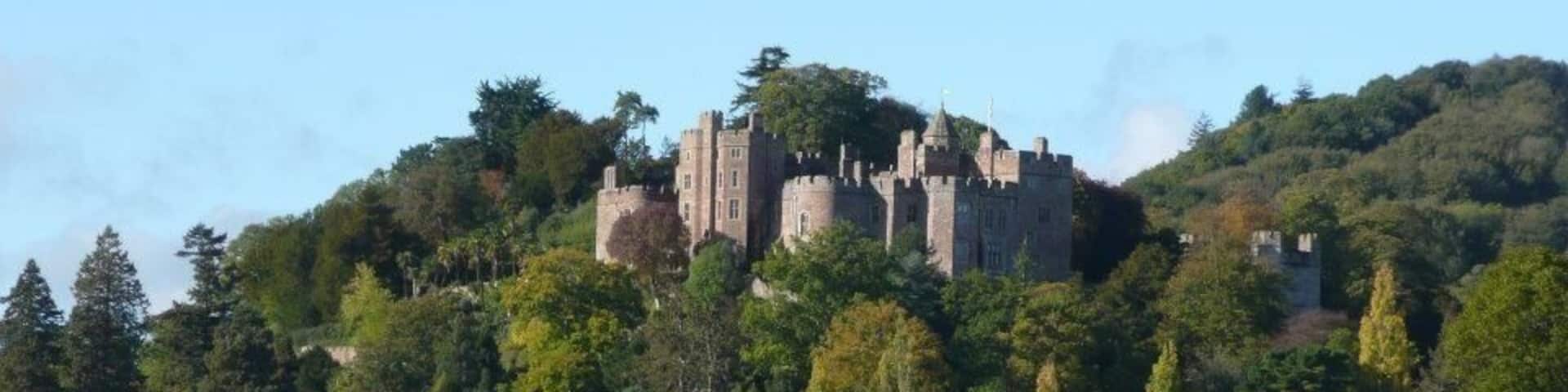 This is Dunster Castle, near Minehead in North Somerset. This is the view you get as you approach, and I just think it's such a beautiful sight, rising up out of the trees. There's an ancient castle, plus a more modern (as in 17th century modern) Manor House. The last residents gave it to the National Trust to look after. Dunster Village is also very pretty and worth a little wander through.