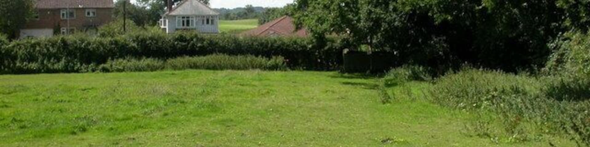 West Parley, footpath. The Southern end of a path from Christchurch Road to 1422064. On the other side of Christchurch Road, Dudsbury Golf Club.