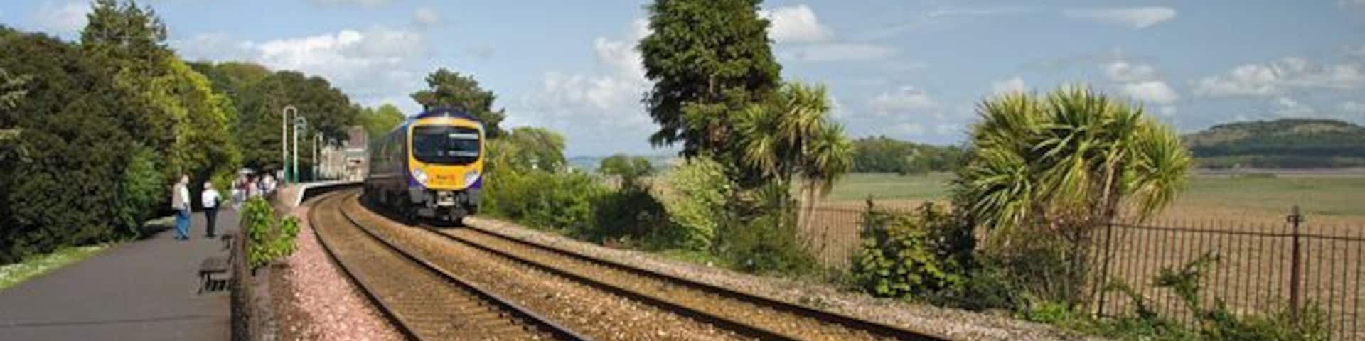 Leaving Grange station An afternoon train from Manchester to Barrow leaves Grange.