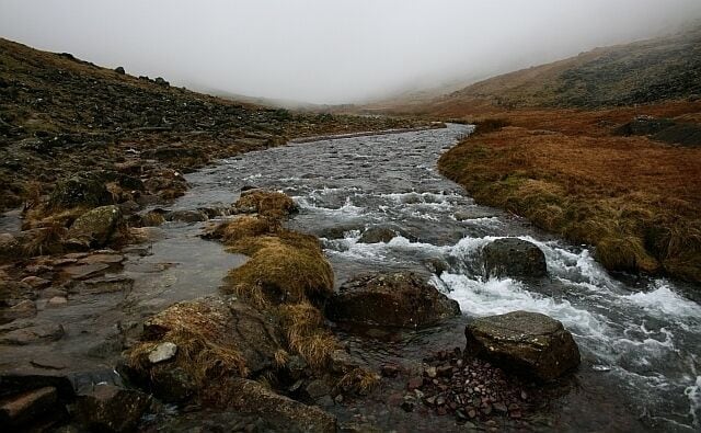 Near the Top of Styhead Gill Another five minutes further up and the gill gives way to Styhead Tarn. Let's hope the mist gives way too.