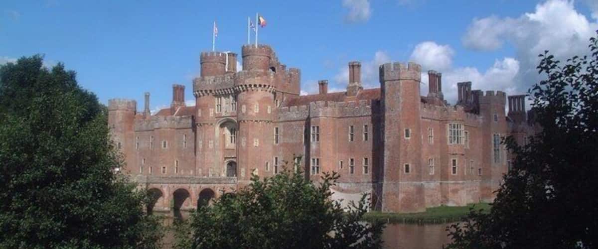 A large castle with multiple towers and a moat.