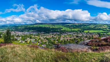 A panorama view from Ilkley moor over Wharfedale and the town of Ilkley Yorkshire, UK in summertime