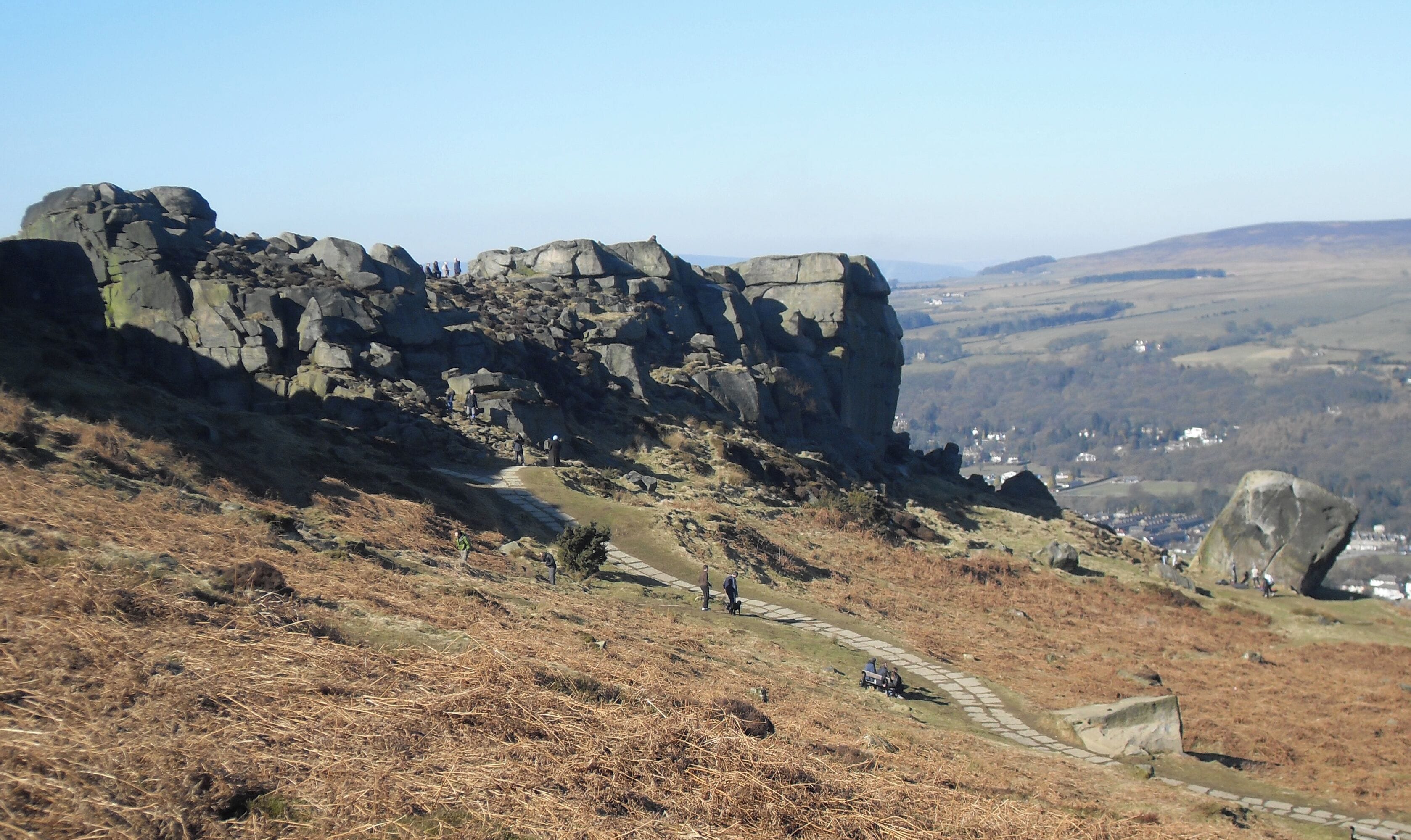 A rocky hillside with a stone path leading up.