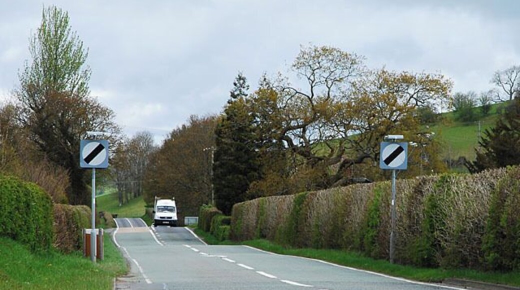 The A489 exits east from Penegoes