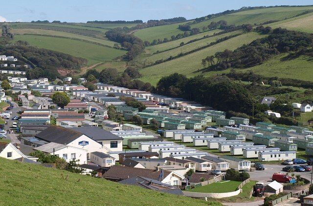 Caravans at Challaborough. The valley behind the beach shown in 221910 is occupied by Challaborough Bay Holiday Park. Beyond is the southern arm of the valley, climbing into the South Hams countryside.
