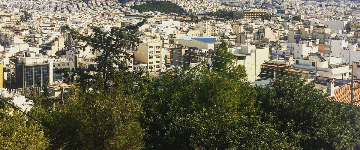 A cityscape with mountains in the background.