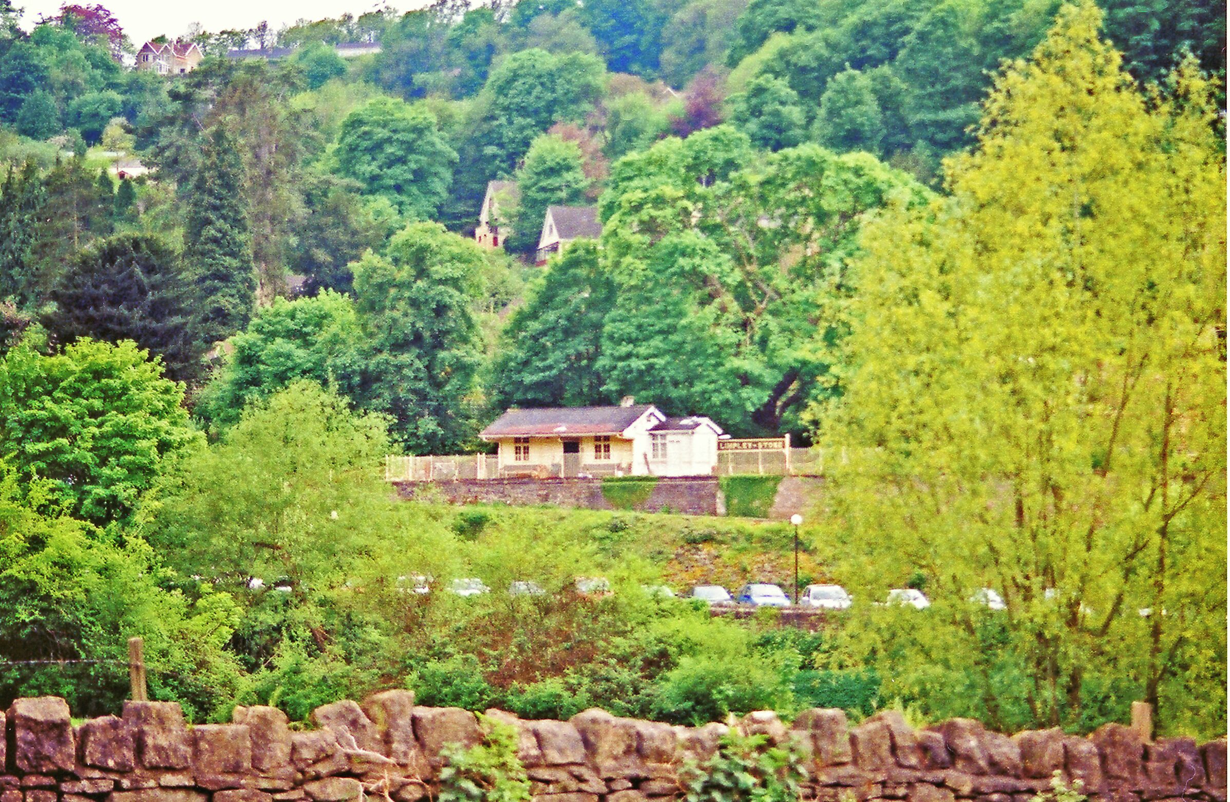 Former Limpley Stoke station, from across Avon Valley. View westward, the railway being the ex-GWR Bath (to right) - (to left) Westbury secondary main line. In spite of appearances, the station was closed from 3/10/66: it has been restored, as a restaurant.