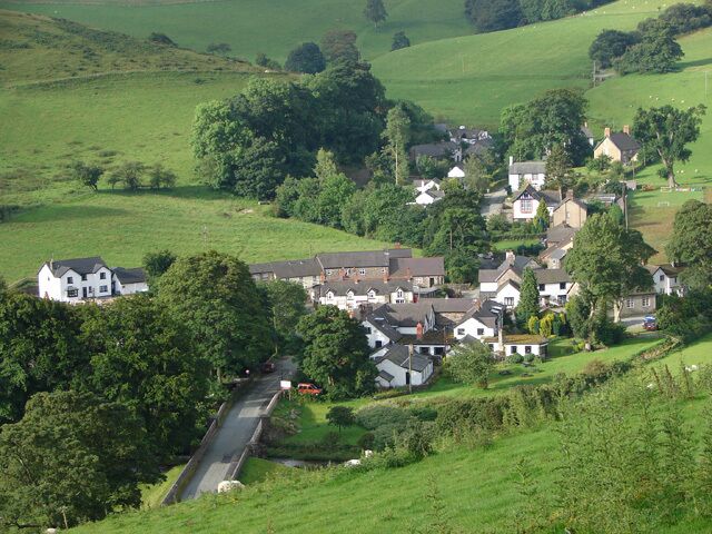 A rural village with houses and a road.