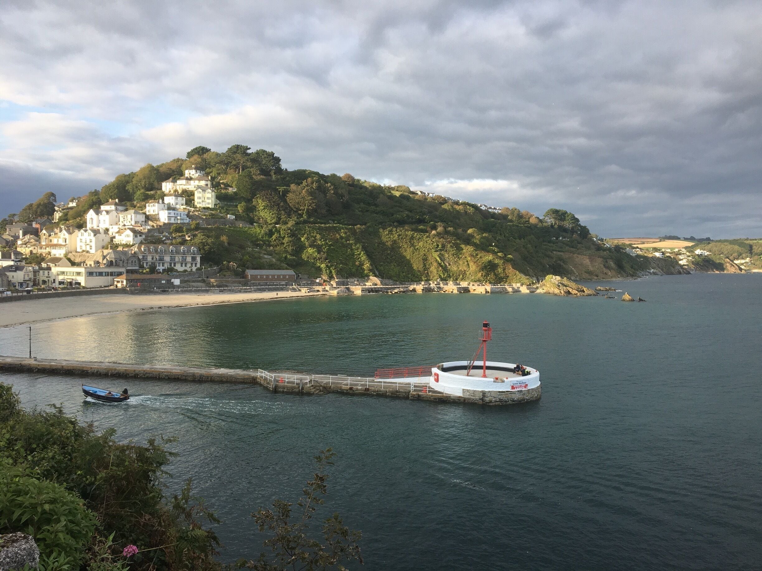 This is Looe banjo pier. Taken from Hannover point. Looe is a small fishing town in north Cornwall. A great place to visit with amazing river views.
