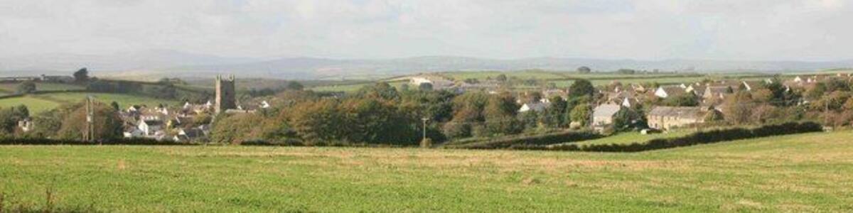 Pelynt in the distance As seen from the gateway by Becons trig point, Pelynt churchtower is in the middle of the village with Hall Barton farm on the right.