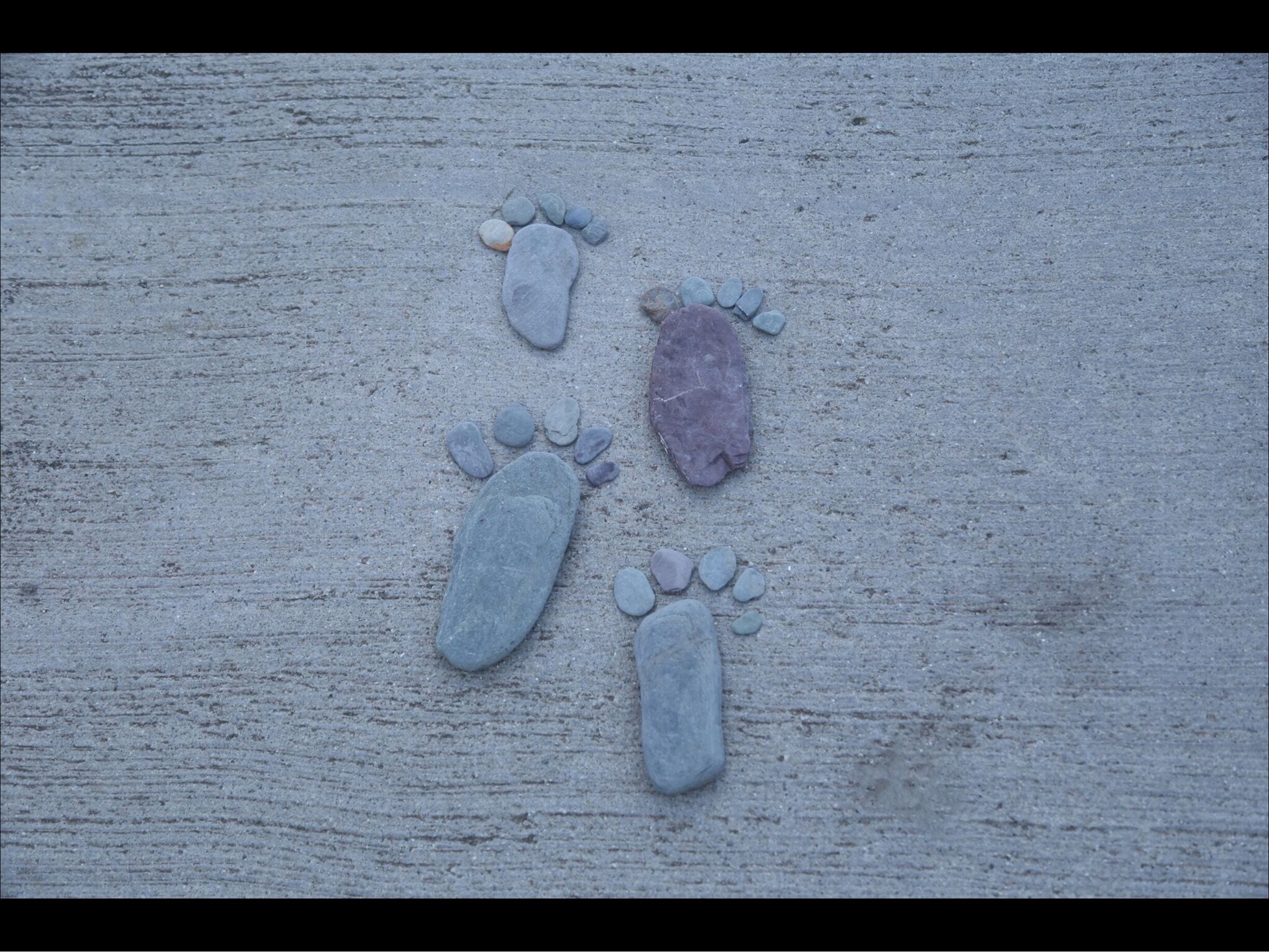 Finding a stone the size of our feet was great fun making our stone footprint