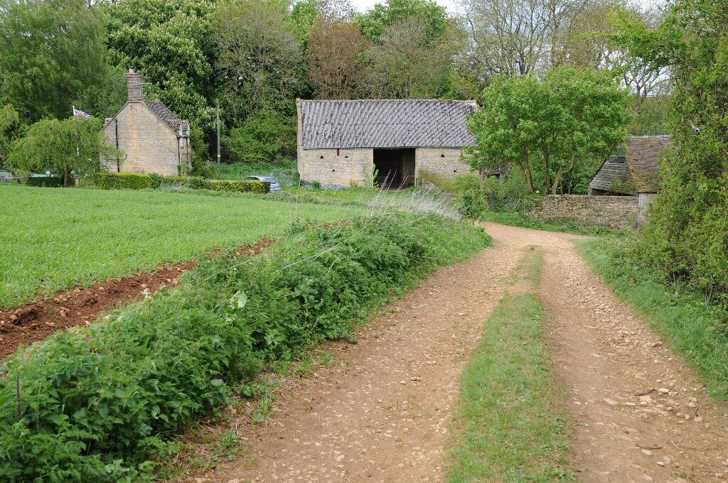 Warren Farm viewed from a footpath above the Cotswold village of Blockley.