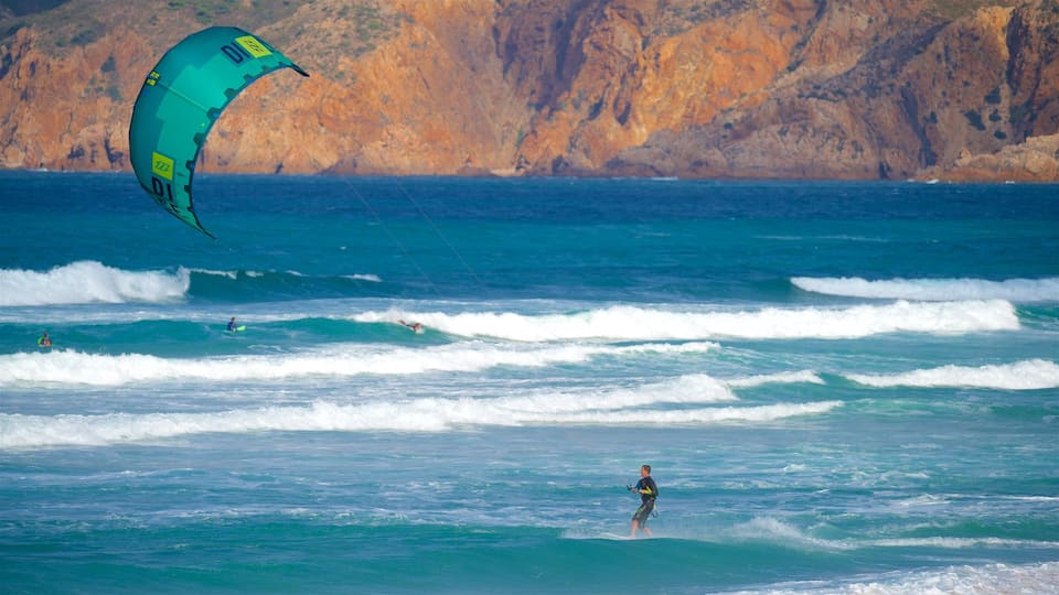 Praia do Guincho featuring general coastal views, rocky coastline and kite surfing