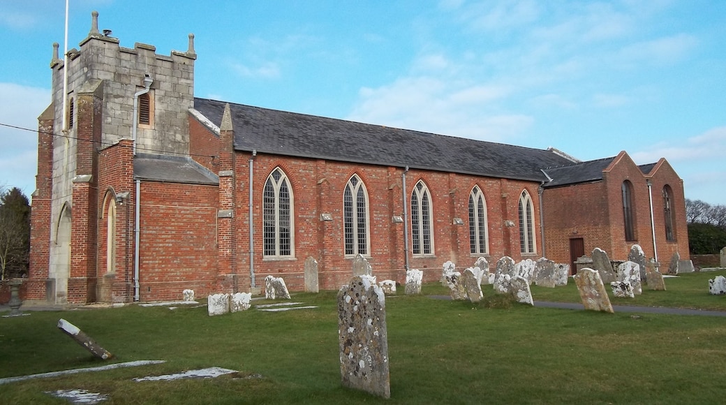 St Mary Magdalene parish church, New Milton, Hampshire, seen from the southwest. The stone tower is 17th-century; the brick nave and buttresses were completed in 1832, and the lady chapel (right) was added in 1958.
