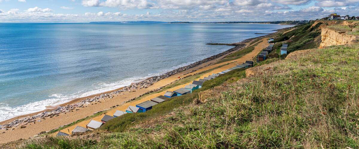 Beach Huts on the Channel Coast in Barton-on-sea, Hampshire, England, UK
