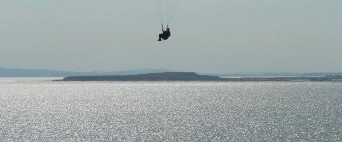 Hengistbury Head from Barton on Sea This view of Hengistbury Head was taken from Marine Parade East, Barton on Sea. The paraglider is far closer to Barton than to Hengistbury! Purbeck is in the distance.