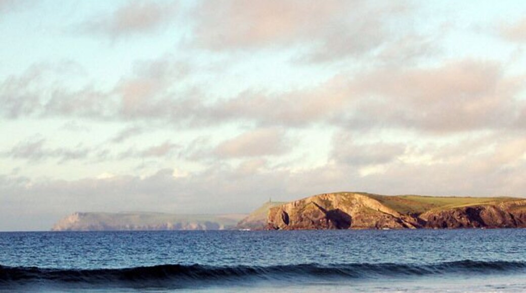 Three headlands seen from Harlyn Bay Looking north-east from the beach at Harlyn Bay. The evening sun illuminates three headlands: Pentire Point (on left, far distance); Stepper Point (centre, surmounted by tower); and Gunver Head (right).