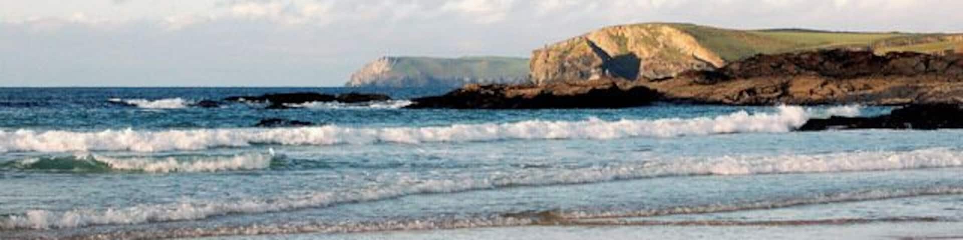 View to Gunver Head from Harlyn Bay Looking north-east from the cliffs east of Harlyn Bay towards Gunver Head (centre) and Pentire Point (on skyline).