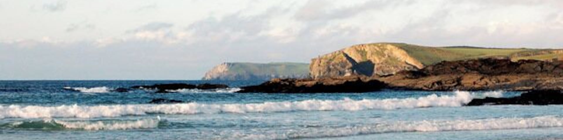 View to Gunver Head from Harlyn Bay Looking north-east from the cliffs east of Harlyn Bay towards Gunver Head (centre) and Pentire Point (on skyline).