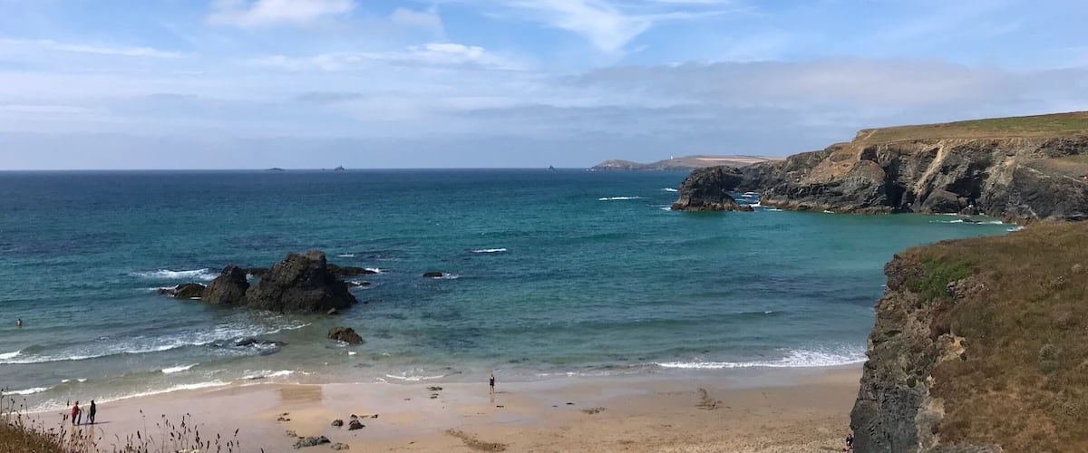 Porthcothan Bay, Cornwall is a lovely sandy beach which opens out at low tide. 
Such a great place to take the family, for a fun day out on the beach. 
If you follow the UK coastal path, you’ll see signs to the nearby cafe which has great snacks, coffees, ice creams & local produce & supplies it’s handy if you’re camping or have accommodation nearby. Porthcothan Bay is fun for all ages!
