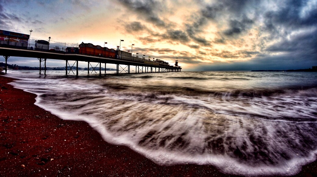 Paignton Pier in the English Riviera before sunrise. Taken with a Nikon camera and fisheye lens.