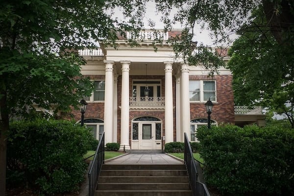 Completed in 1910, the Herndon Home, was the residence of Alonzo Herndon and his family. Herdon was a former slave raised in a sharecropping family after the Civil War. Herndon studied barbering, and owned and managed a string of barbershops in downtown Atlanta after the Civil War, one of which was considered to be the most elegant in the country with marble floors and chandelier. Investing his income into real estate, Herndon became the largest black property owner in Atlanta by 1900. Later, Herndon founded the Atlanta Life Insurance Company, located in the Sweet Auburn Historic District, and became Atlanta's first black millionaire. The home was primarily designed by Adrienne Herndon, Alonzo's first wife and a teacher at Atlanta University. The couple had one son, Norris. Adrienne died of Addison's disease just three months after the home was completed. In 1912 Alonzo married Jessie Gillespie.
The Herndon home is a two-story, 15-room Beaux Arts mansion built by local black craftsmen. The formally composed building is constructed with multi-colored brick, and features a two-story entry portico supported by Corinthian columns. One-story porches to each side of the building echo this theme in brick piers and wooden capitals. An elliptical fanlight over the main entrance and the balustrade above the full entablature of the building's cornice add a distinctly Georgian Revival flavor to this imposing residence. The Herndon Home is a lasting tribute to the hard work and talent of extraordinary African Americans in Atlanta, and was designated a National Historic Landmark in 2000.
