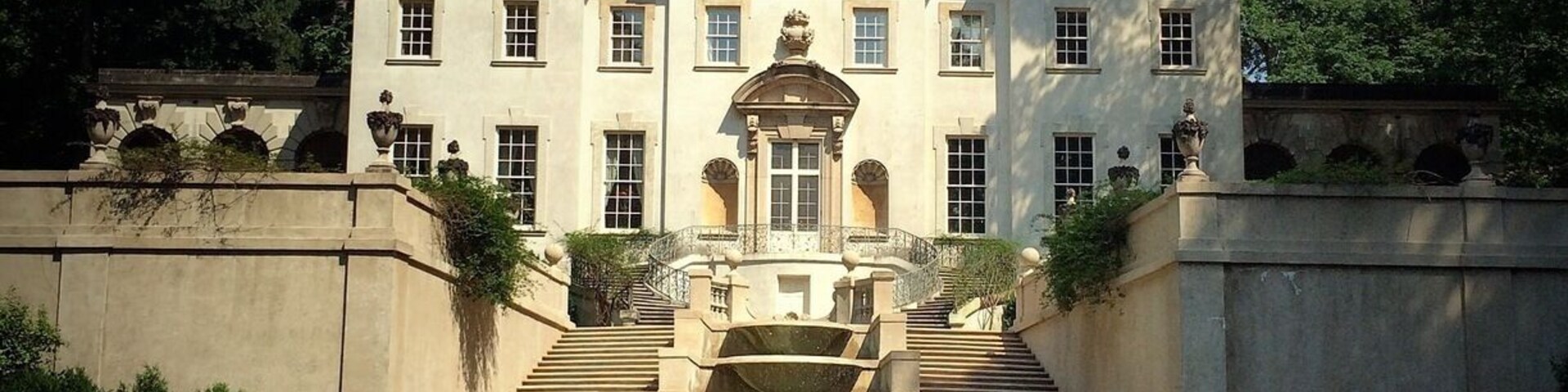 Swan House was completed in 1928 for Mr. and Mrs. Edward Hamilton Inman, heirs to a cotton-brokerage fortune. Named for the swan motif found throughout the interior, the house was designed by architect Philip Trammell Shutze (1890-1982), of the Atlanta firm Hentz, Reid and Adler. In 1977, Shutze was recognized as America’s greatest living Classical architect.
In addition to the exceptional architectural design, Swan House features embellishments by several noted artists. Naturalist, muralist, and eminent bird painter Athos Menaboni decorated Mrs. Inman’s dressing room. Herbert J. Millard hand-carved wood components throughout the home and prominent interior decorator Ruby Ross Wood consulted on several of the main rooms.
In 1966, under the leadership of Mrs. Ivan Allen Jr., the Atlanta Historical Society purchased Swan House and most of its original furnishings, ranging from 18th-century antiques to 20th-century objects. Swan House opened to the public in 1967 and is listed in the National Register of Historic Places and a City-designated Landmark. The property encompasses 22 acres of gardens and forest, all original components of Shutze’s novel site plan.