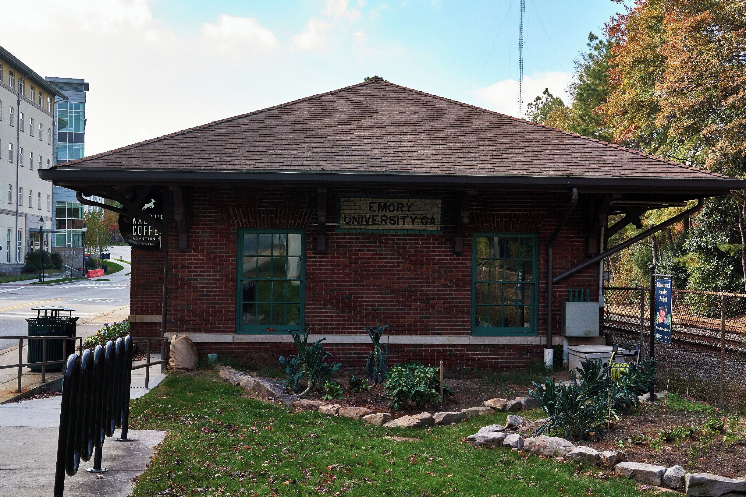 This building has a bit of a history. It was built in 1926 and was the former Emory University railway station for passengers and freight. The present name which is “Dooley’s Den ‘The Depot’” is a reference to the Spirit of Emory - do a Google search for information on Dooley - and the building presently serves coffee.  For some time in the 70’s and into the ‘80s the building was actually the location of the Emory Credit Union.