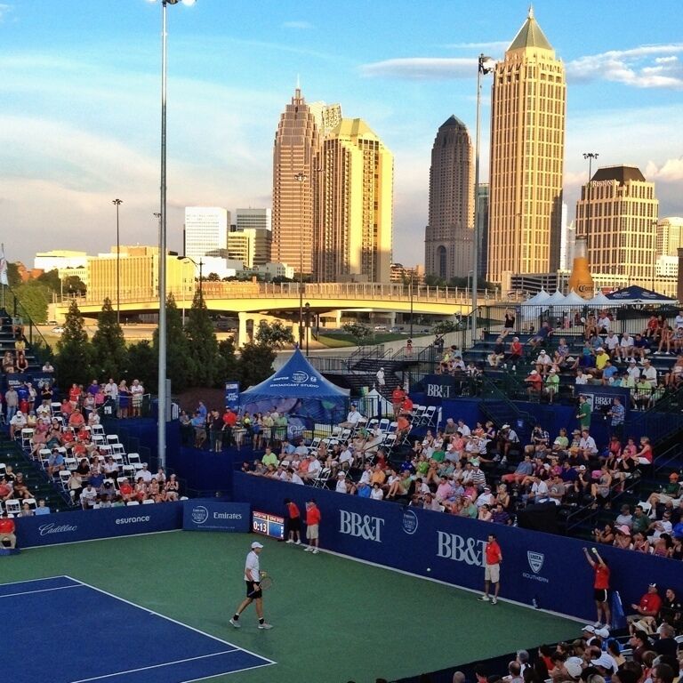 The BB&T Atlanta open, ATP 250, event is a new tennis tournament trying to bring tennis to Atlanta. Two years ago this event moved from Cincinnati to Atlanta. It is odd that Atlanta doesn't have a bigger tournament, considering Atlanta has the largest recreational and USTA players in the country. 

Amazingly, this event is set up on the side of a new outdoor mall in Atlanta. Three weeks before the event concrete was poured and scafolding erected. All. The courts and grounds were created just for this event, and after will be taken down. 

For the past couple years I've wanted to go to this event. As a tennis player, it's amazing to see the best in the world play and show that I'll never be nearly as good. So my friend and I went, to what I thought would be the quarter finals, but due rain delays, it was the second round. We got to see Isner, fish, and Blake play their respective opponents. It was a great day! There are vendors and activities around the area. Your tickets are good for all courts, and all day. Just bring lots of sunscreen, I got burned! 