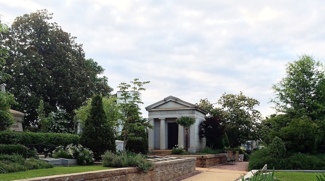 City fathers purchased six acres in 1850 to be a public burial ground for a young but fast-growing town that already had a population of more than 2,500. It was designed as a rural garden cemetery, a 19th Century innovation conceived as an alternative to traditional graveyards which often were crowded and aesthetically unappealing.
Originally called Atlanta Graveyard or City Burial Place, Oakland was renamed in 1872. By then it had expanded to 48 acres, mainly due to pressures of the Civil War. During the war, the City and the Confederate government added land to bury soldiers who died in local hospitals. As fighting drew closer and engulfed Atlanta, more burial space was needed. After the war, space was added to provide a proper final resting place for soldiers who had been hastily buried on area battlefields. By 1867 the cemetery reached its present size.
In the late 19th Century, Oakland was a popular destination for Sunday carriage rides and picnics. Families tended the plots of loved ones, creating an assortment of lovely gardens. Atlanta’s first greenhouse was established here in 1870. Many distinctions of daily life were maintained in death, as African Americans were buried apart from whites and Jewish sections were separate from Christian.
As the 20th Century unfolded, Oakland increasingly was surrounded by residential and industrial development. The cemetery also was filling up. The last sites were sold in 1884. With the passage of time, many graves went unattended as descendants moved away or lost touch with their antecedents. Oakland fell into serious disrepair from neglect and occasional vandalism.
In 1976, Oakland was placed on the National Register of Historic Places and the Historic Oakland Foundation was founded. The City and the Foundation have worked together to stabilize the cemetery and make it an attractive and inviting place for all Atlantans.