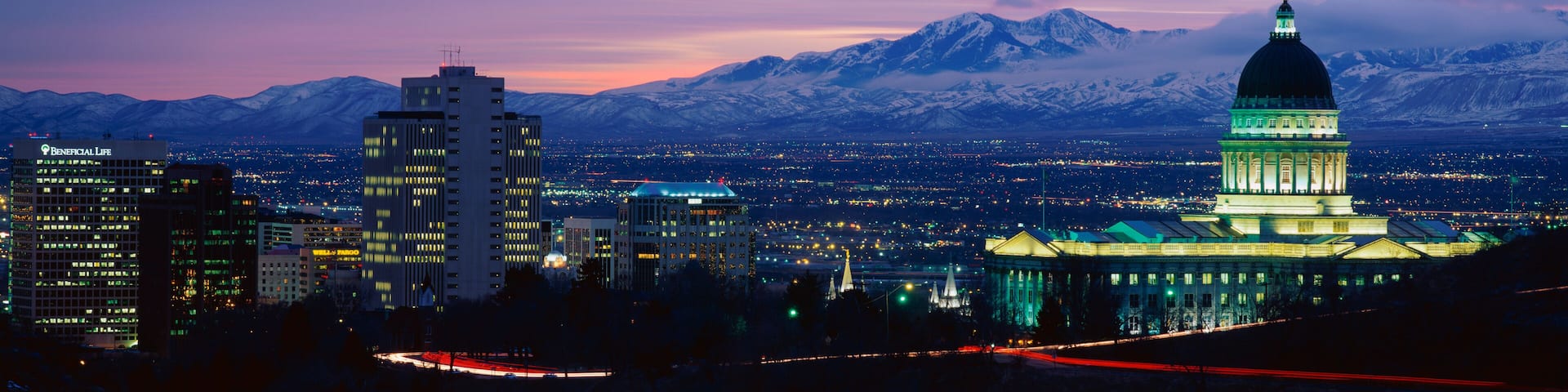 This is the State Capitol, Great Salt Lake and Snow Capped Wasatch Mountains at sunset. It will be the winter Olympic city for the year 2002.
