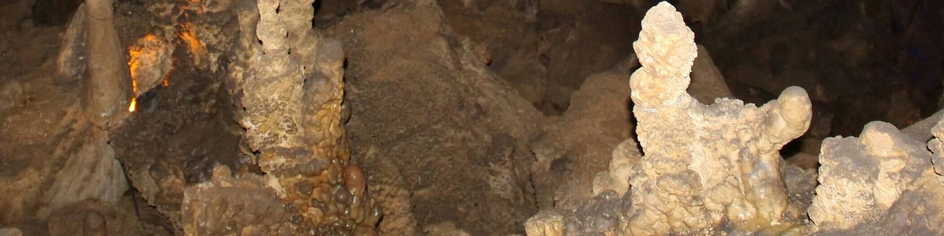 A cave with stalactites and stalagmites.