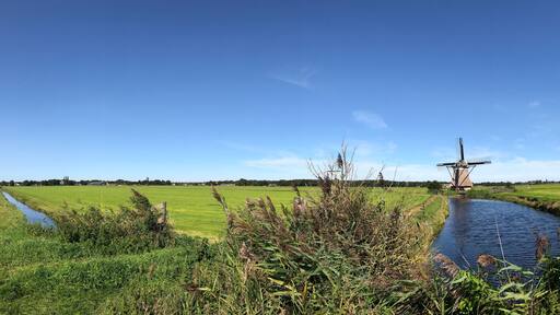 Frisian landscape panorama with windmill