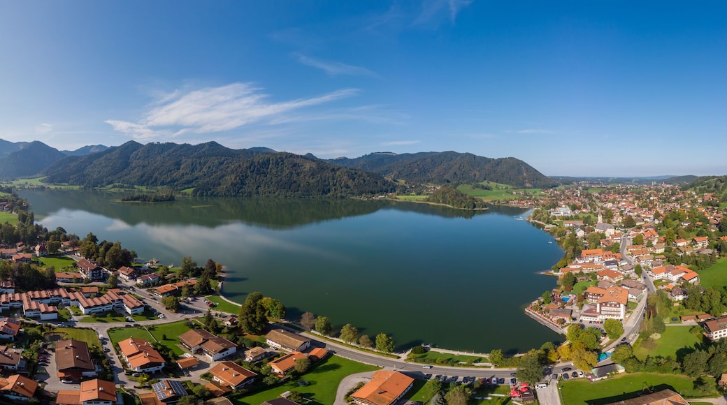Aerial view of the city Schliersee with lake Schliersee and mountains and sky in the background