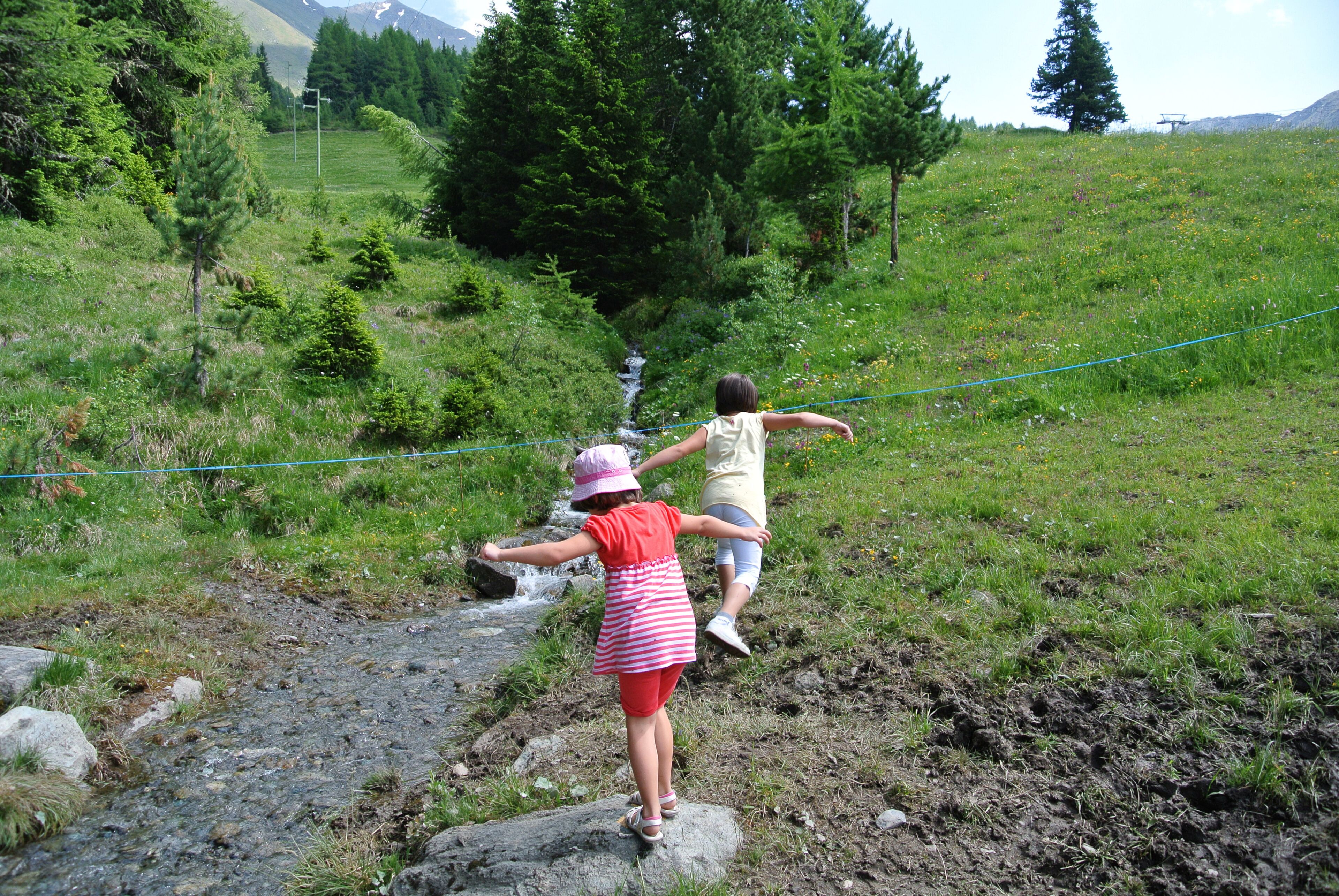 Two girls playing in the mountains. The Aosta Valley Italy