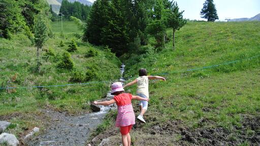 Two girls playing in the mountains. The Aosta Valley Italy
