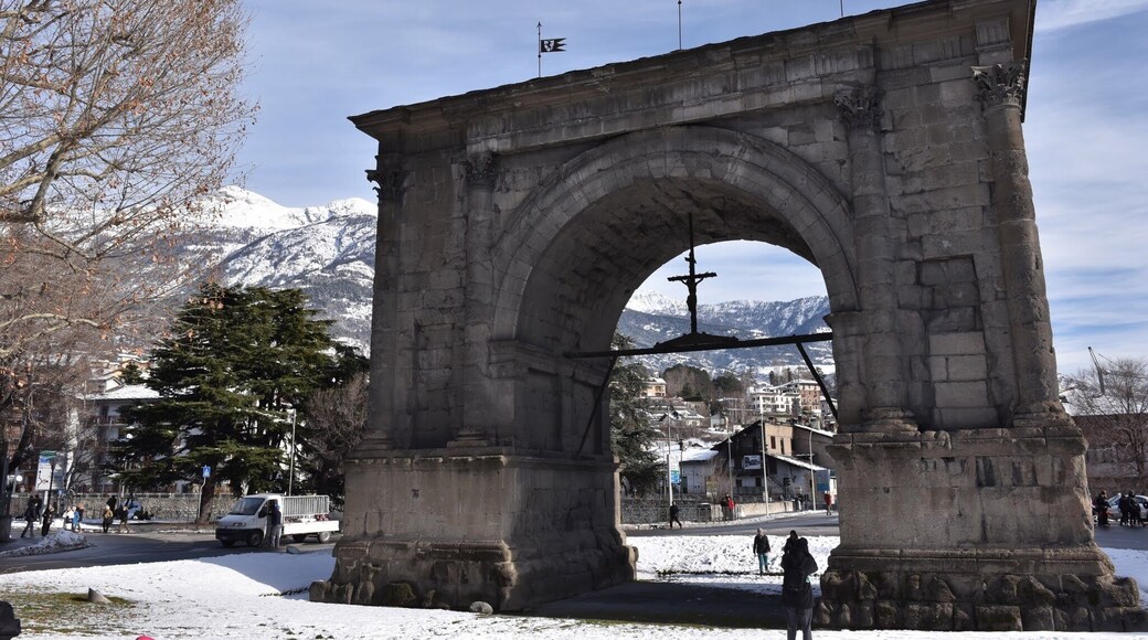 Lying between two rivers and surrounded by majestic mountains, the city of Aosta is a concentration of history and added picturesque traditions. The town has Roman origins, as it is evident from its name, which evokes the one of its founder: the Emperor Augustus. While walking around Aosta it is possible to notice traces of the original town; there are also many Roman monuments, including the Arch of Augustus, the Porta Pretoria, the theatre, the forum and the city walls, almost perfectly preserved.
