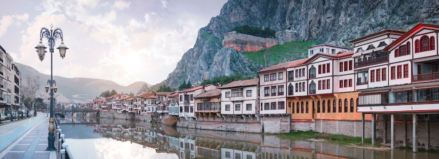 Amasya,TURKEY old riverside Turkish(ottoman) city buildings and its reflection on water,sunny summer day.Amasya is city of princes of ottoman. ottoman Princes were educated in Amasya