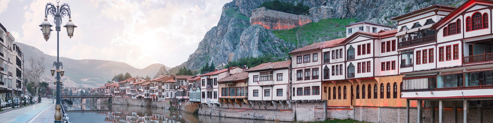 Amasya,TURKEY old riverside Turkish(ottoman) city buildings and its reflection on water,sunny summer day.Amasya is city of princes of ottoman. ottoman Princes were educated in Amasya