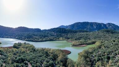The beautiful panorama landscapes of Kovada Lake, mountains and green area from the air Isparta, Turkey Lake District.