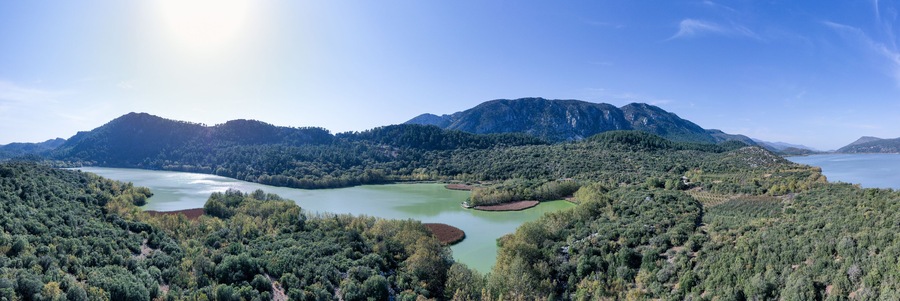 The beautiful panorama landscapes of Kovada Lake, mountains and green area from the air Isparta, Turkey Lake District.