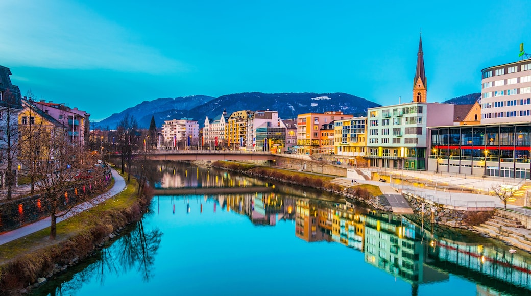 view of a riverside of river Drau during sunset in Villach, Austria