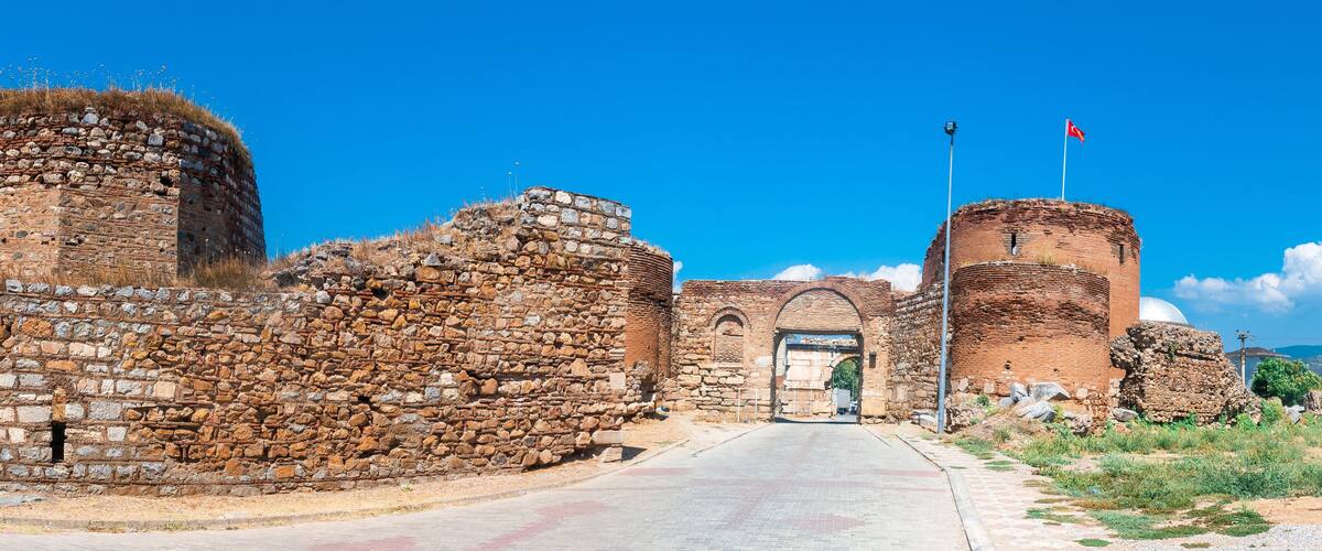Ancient stone ruins with a clear sky.