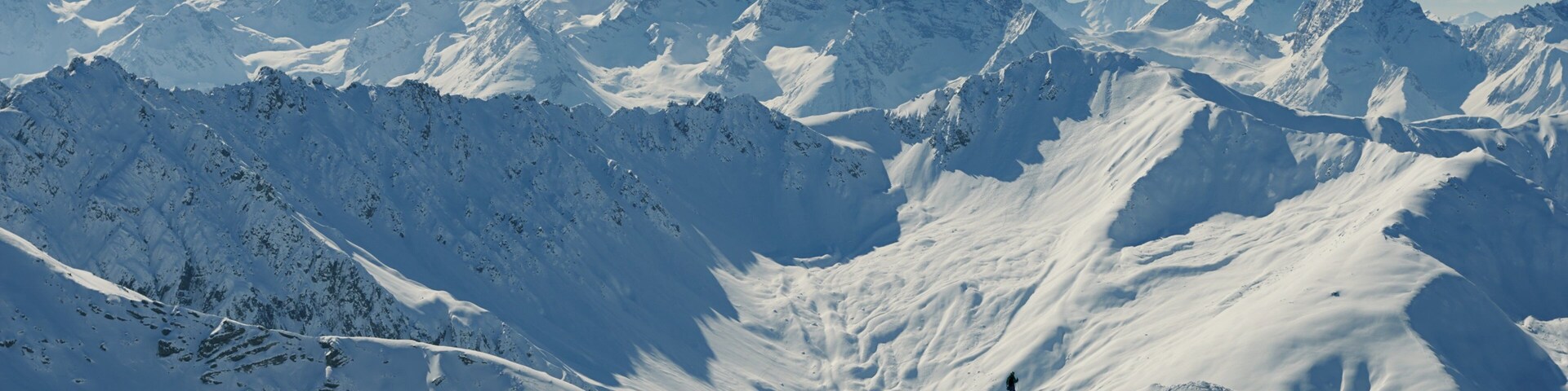 Davos showing mountains, snow and a sunset