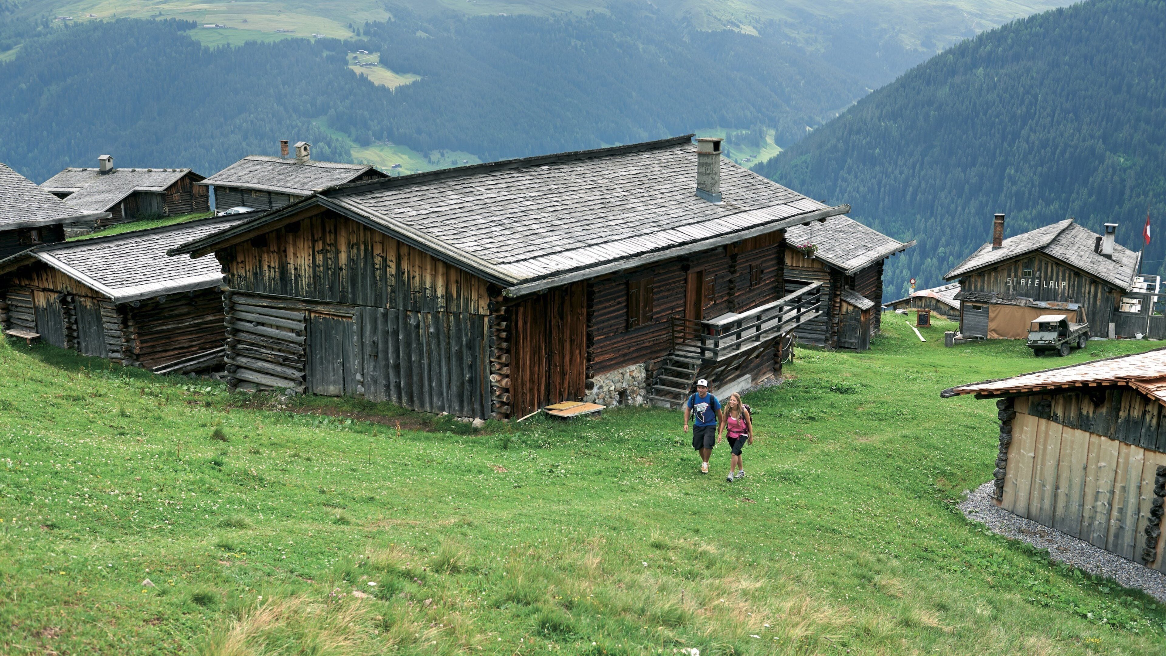 Davos featuring a small town or village and hiking or walking as well as a couple