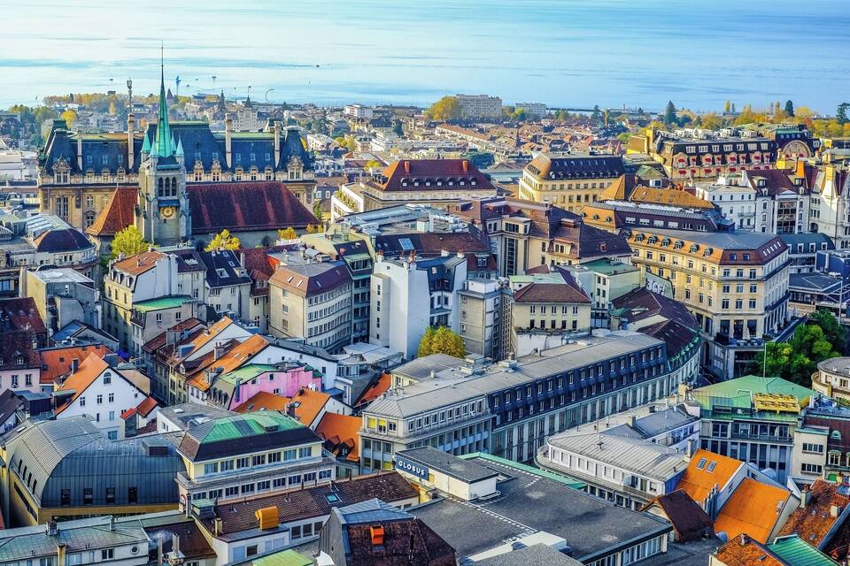 A densely packed urban area with historic architecture and a waterfront.