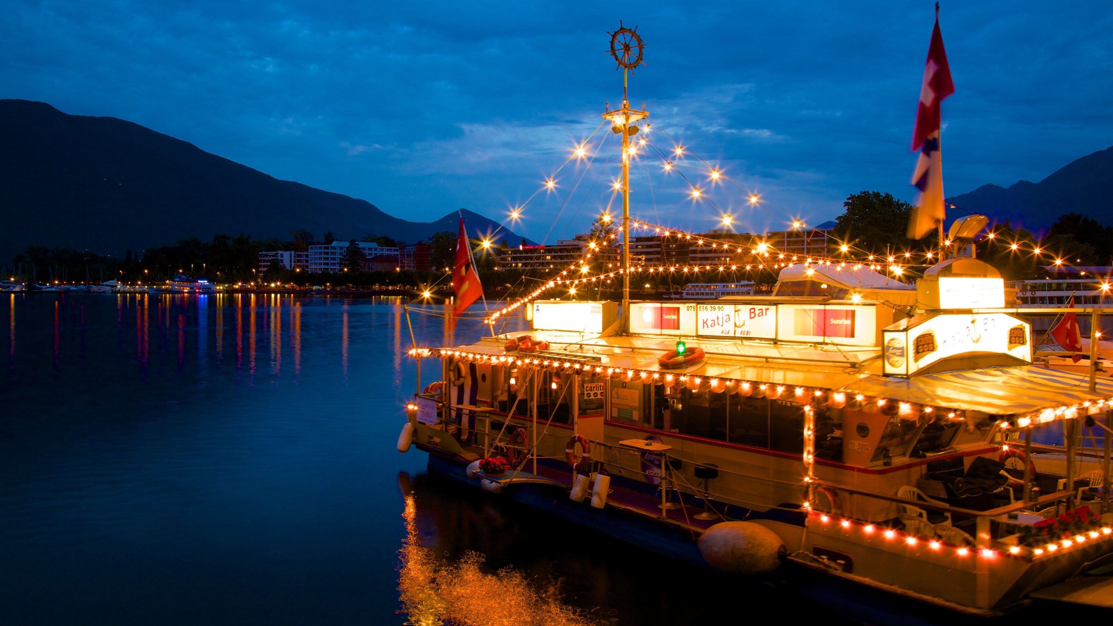 Locarno showing a bay or harbor and night scenes