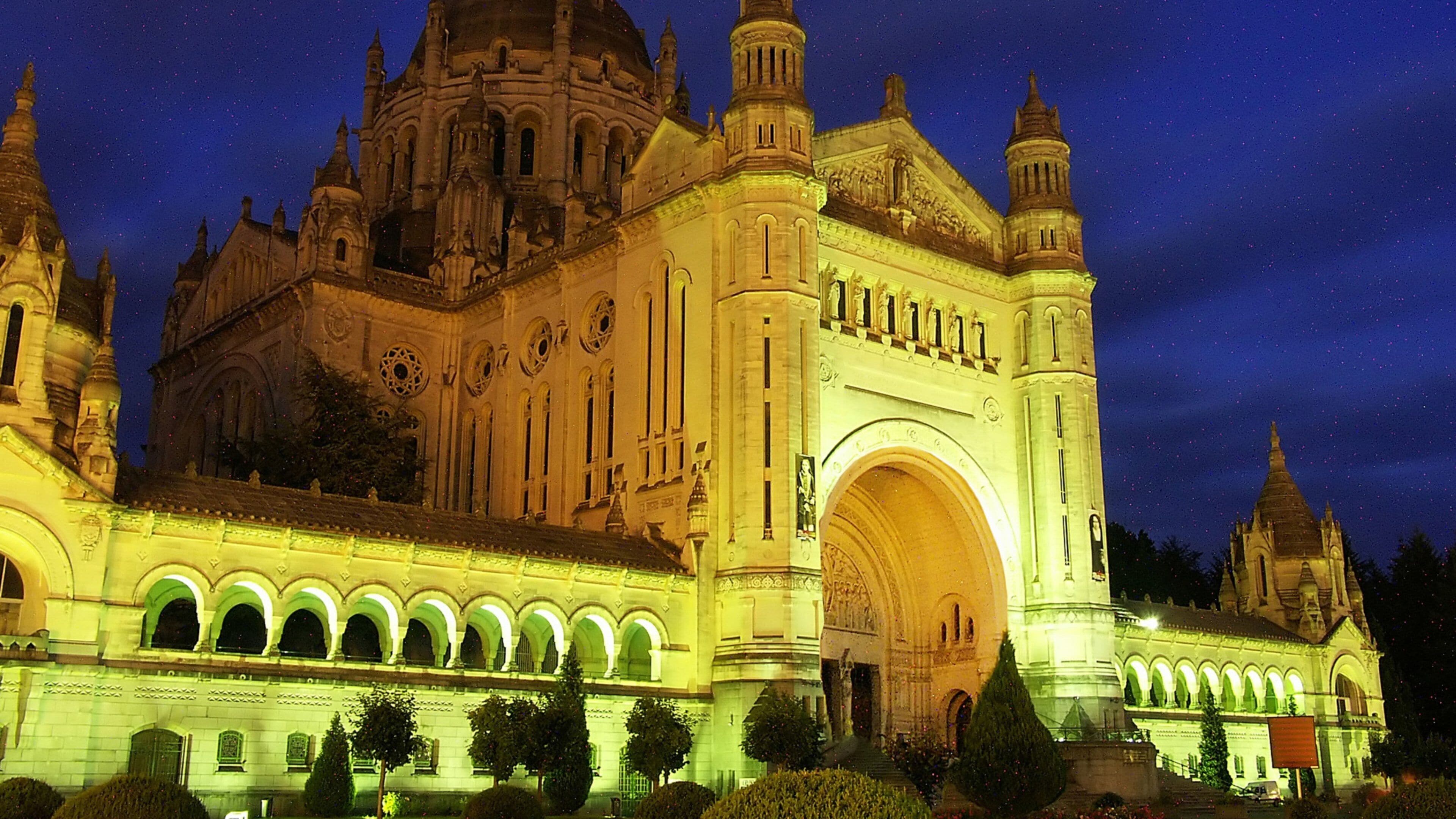 Lisieux which includes religious elements, night scenes and a church or cathedral