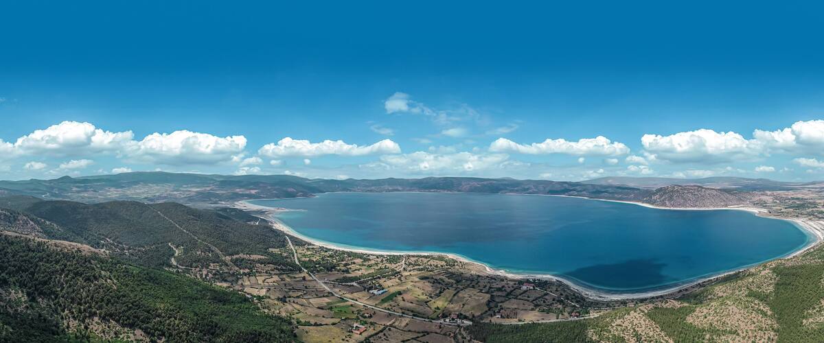 Blue waters and volcanic peebles of magical Salda Lake in Burdur, Turkey.