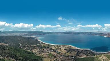 Blue waters and volcanic peebles of magical Salda Lake in Burdur, Turkey.